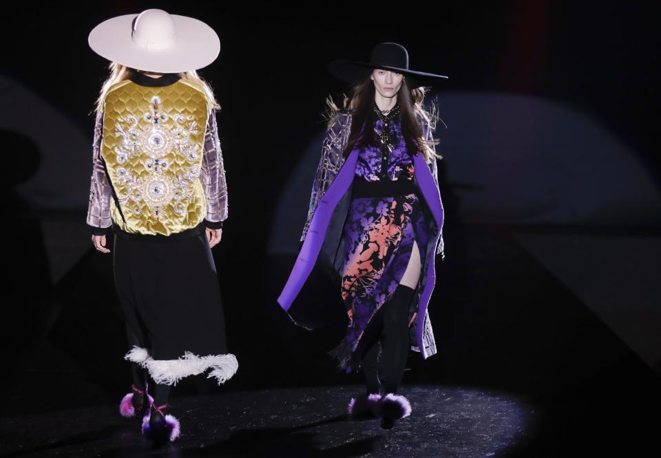 Models wears creations part of the Fausto Puglisi women's Fall-Winter 2017-18 collection, that was presented in Milan, Italy, Wednesday, Feb. 22, 2017. (AP Photo/Luca Bruno).