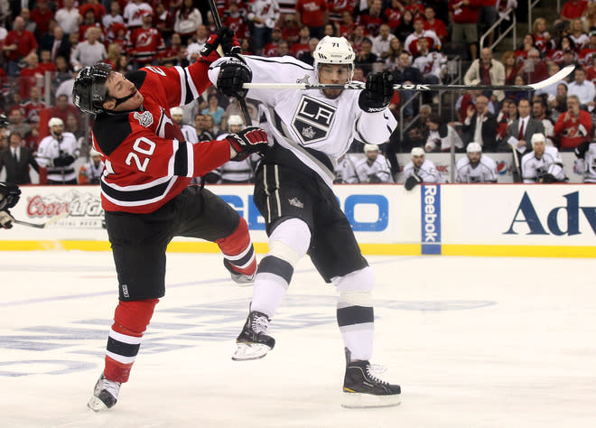 NEWARK, NJ - JUNE 02: Jordan Nolan #71 of the Los Angeles Kings makes contact with Ryan Carter #20 of the New Jersey Devils during Game Two of the 2012 NHL Stanley Cup Final at the Prudential Center on June 2, 2012 in Newark, New Jersey. (Photo by Elsa/Getty Images)