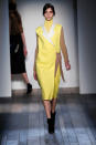 <b>Victoria Beckham AW13 at New York Fashion Week </b><br><br>Victoria kitted out this model in head-to-toe canary yellow with camel coloured sleeves.<br><br>Image © Getty