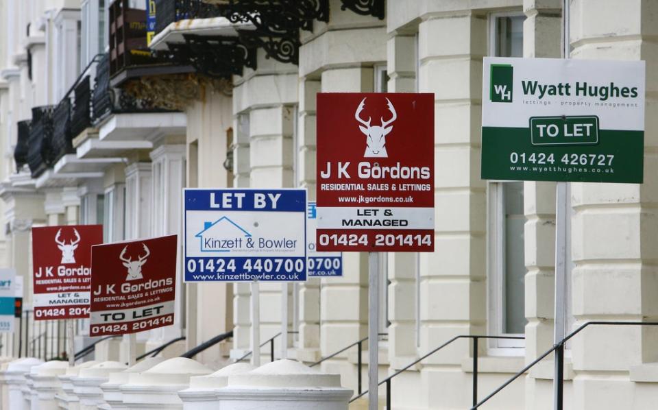 Estate agent boards outside properties  (PA Archive)