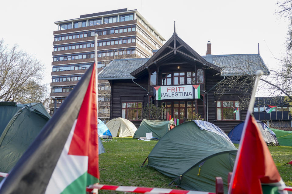 Students set up tents on the grounds of the University of Oslo, in protest against the war in Gaza, in Oslo, Thursday, May 2, 2024, replicating the nationwide campus demonstrations in the US. Sign on building in the background reads "Free Palestine". (Terje Pedersen/NTB Scanpix via AP)