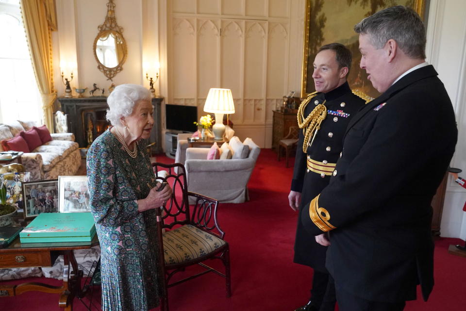 Britain's Queen Elizabeth hosts Rear Admiral James Macleod and Major General Eldon Millar as she meets the incoming and outgoing Defence Service Secretaries at Windsor Castle, Berkshire, Britain  February 16, 2022. Rear Admiral Macleod relinquished his appointment as Defence Services Secretary as Major General Millar assumed the role. Steve Parsons/Pool via REUTERS