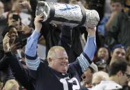 Toronto Mayor Rob Ford watches the CFL eastern final football game between the Toronto Argonauts and the Hamilton Tiger Cats in Toronto, November 17, 2013. REUTERS/Fred Thornhill (CANADA - Tags: SPORT FOOTBALL)