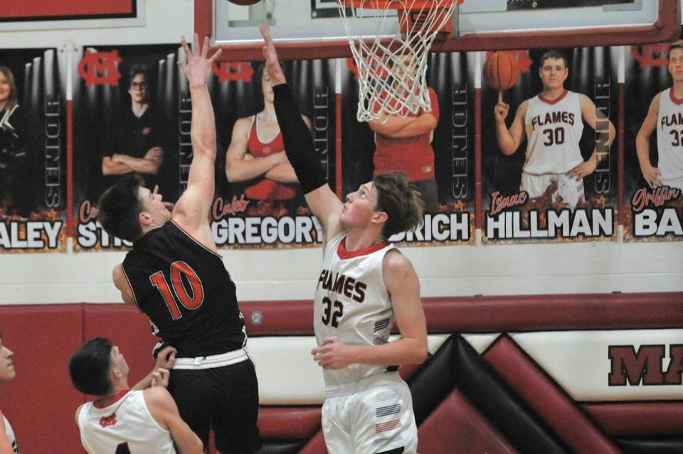 Lucas' Aiden Culler shoots over Mansfield Christian's Griffin Baker.