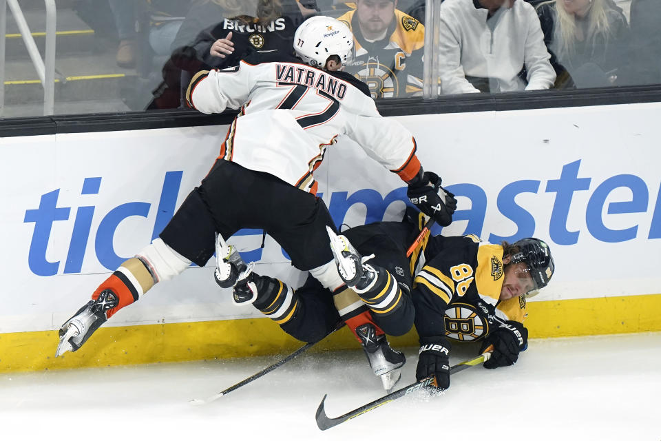 Anaheim Ducks right wing Frank Vatrano, left, collides with Boston Bruins right wing David Pastrnak during the first period of an NHL hockey game Thursday, Oct. 20, 2022, in Boston. (AP Photo//Steven Senne)