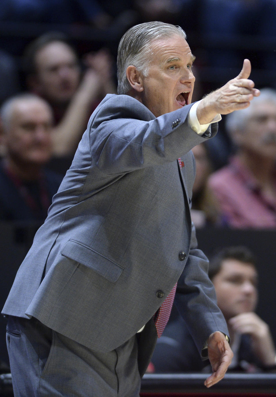 San Diego State coach Brian Dutcher reacts from the bench during the second half of an NCAA college basketball game against Fresno State Wednesday, Jan. 1, 2020, in San Diego. San Diego won 61-52. (AP Photo/Orlando Ramirez)