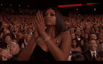 Taraji P Henson standing up and applauding from an audience