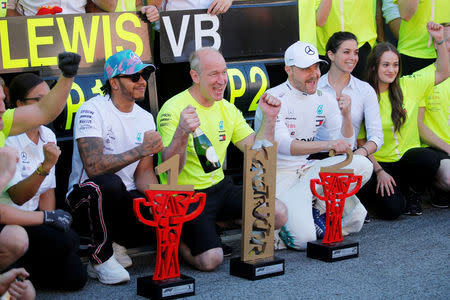 Formula One F1 - Spanish Grand Prix - Circuit de Barcelona-Catalunya, Barcelona, Spain - May 12, 2019 Mercedes' Lewis Hamilton and Valtteri Bottas celebrate with their team after victory REUTERS/Jon Nazca