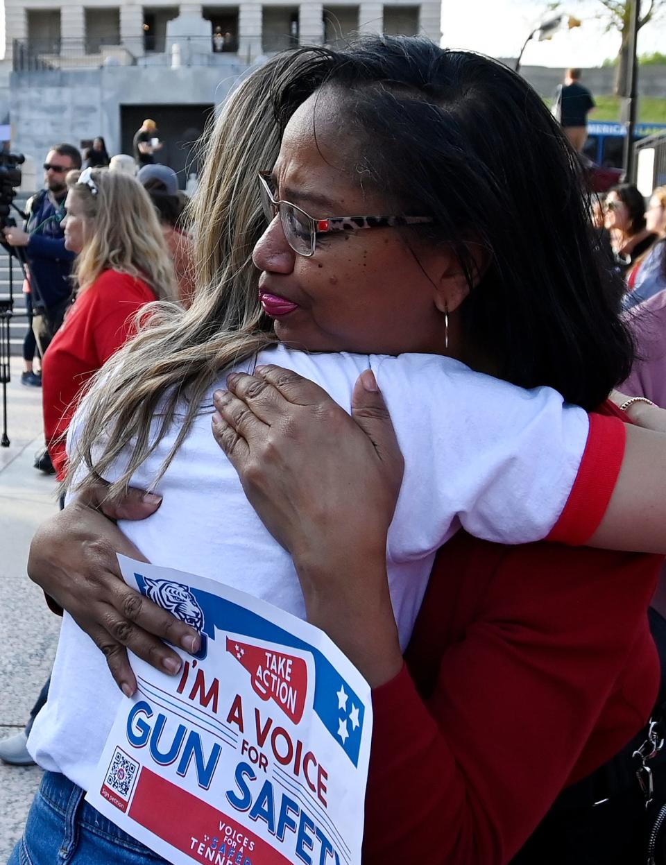 Denise Harris, right, hugs a Covenant School parent after the gun safety and common-sense gun laws 3-mile human chain that started at the Monroe Carell Jr. Children’s Hospital at Vanderbilt and ended at the Tennessee State Capitol April 18 in Nashville.