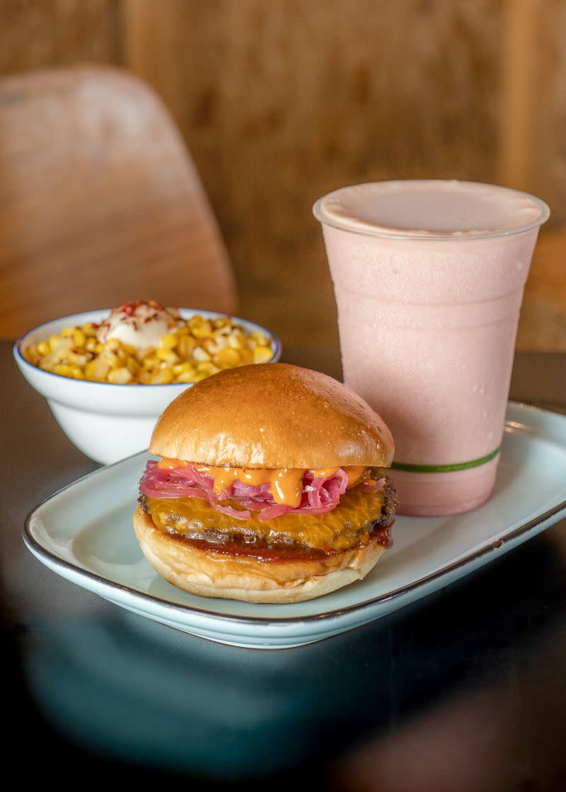 Shot of Tiga Roti burger, Kids of the Corn, and milkshake