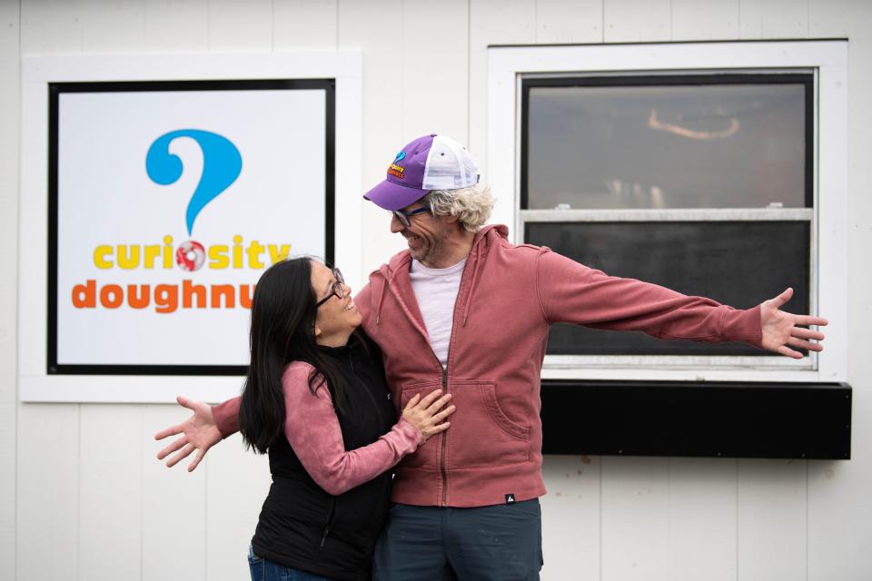 Chef and business owner partners Aki Kamozawa, left, and Alex Talbot pose for a portrait outside their soon-to-open doughnut shop Curiosity Doughnuts in Doylestown on Wednesday, Jan. 25, 2023.