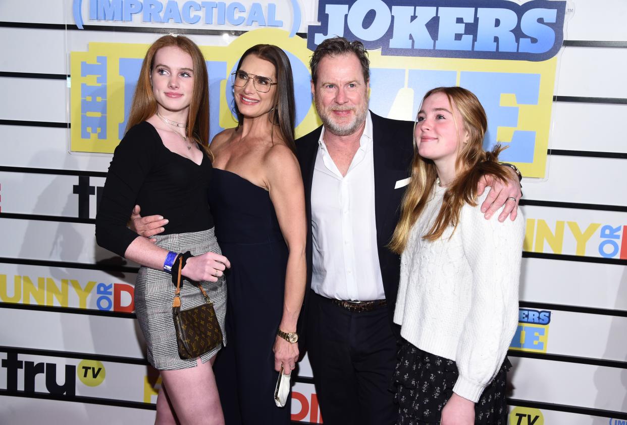 In this file photo, Brooke Shields, center left, and Chris Henchy pose with daughters at the screening of "Impractical Jokers: The Movie" on Feb. 18, 2020 in New York.