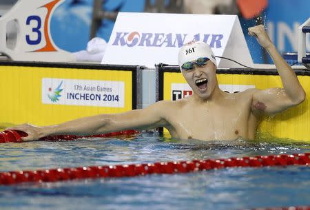 Gold medallist Sun Yang of China reacts after winning the men's 400m freestyle final swimming competition at the Munhak Park Tae-hwan Aquatics Center during the 17th Asian Games in Incheon September 23, 2014. REUTERS/Tim Wimborne