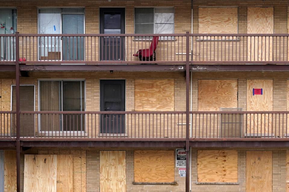 Apartments boarded up while tenants were still inside in Harvey, Illinois (AP)