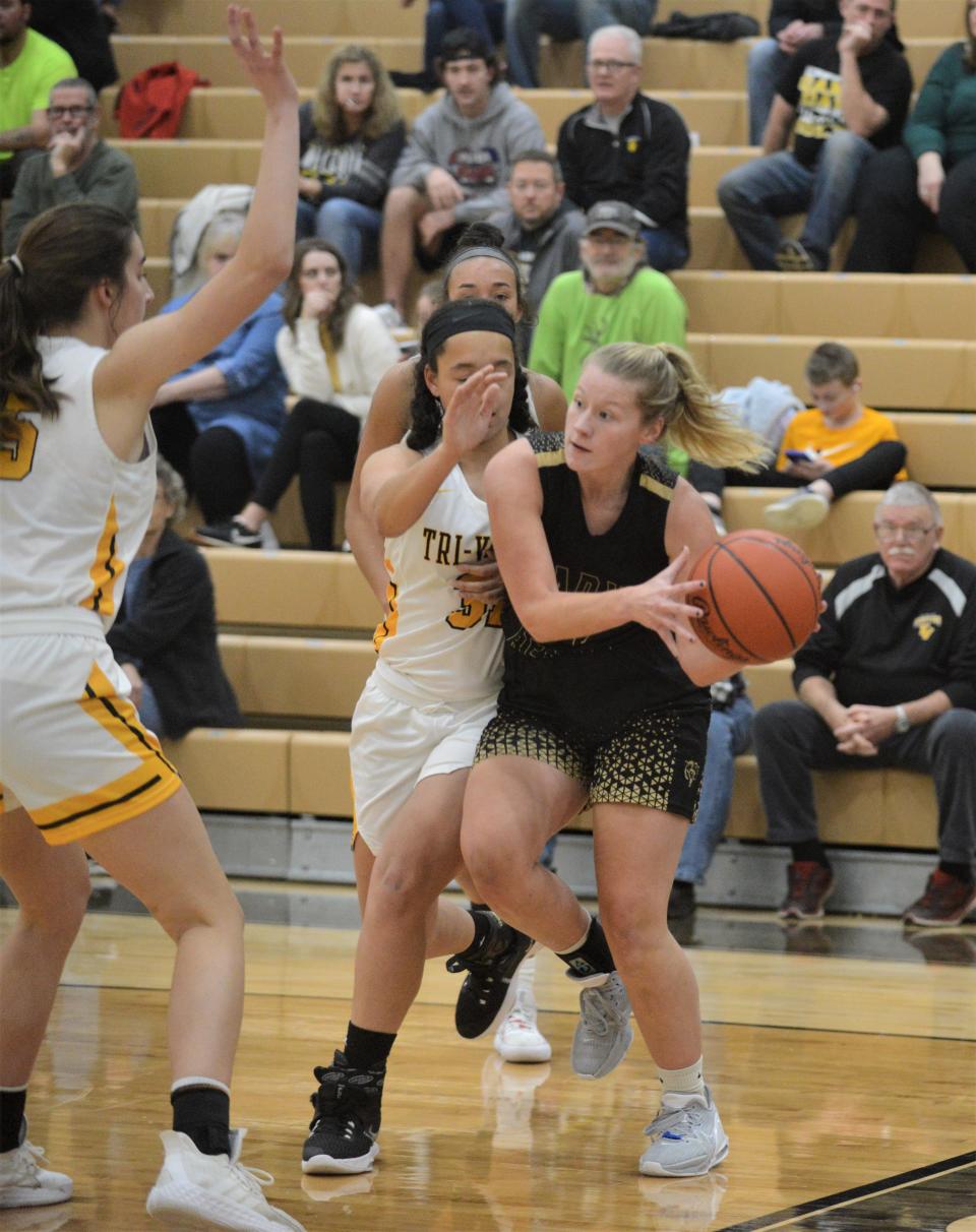 River View's Lily Yoder is trapped by Tri-Valley's Mackenzie Harvey in Wednesday's MVL game. The Scotties won 58-16.