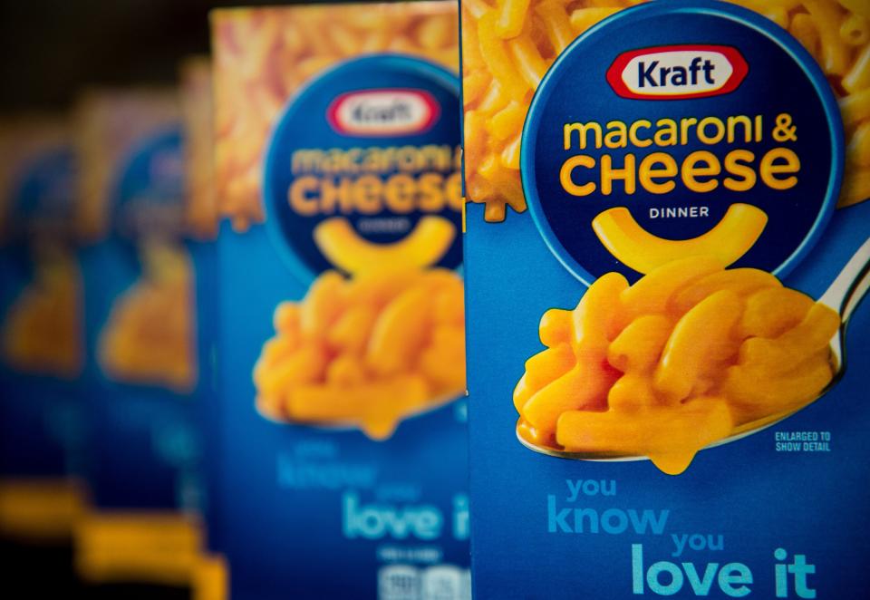 WITH AFP STORY: LIFESTYLE-US-FOOD-KRAFT-MACANDCHEESE This photo illustration shows packs of Kraft's macaroni and cheese in Washington on April 21, 2015. From January next year, two kinds of yellow dye will no longer be added to the packaged dry pasta and processed cheese mix that is famous for its gooey yellow-orange look. Instead, natural ingredients like paprika, annatto and turmeric will be used, said Kraft in a statement on April 20th that promised no change in how Mac and Cheese actually tastes.   AFP PHOTO / NICHOLAS KAMM        (Photo credit should read NICHOLAS KAMM/AFP via Getty Images)