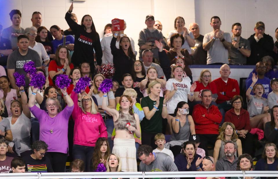 Fans cheer the finish of the 500 yard freestyle during the DIAA state swim and diving championships at the Rawstrom Natatorium at the University of Delaware, Saturday, Feb. 24, 2024.
