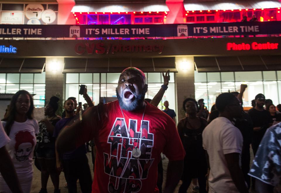 A protester chants during a demonstration against police brutality.