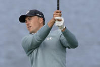 Jordan Spieth follows his shot from the seventh tee of the Pebble Beach Golf Links during the third round of the AT&T Pebble Beach Pro-Am golf tournament Saturday, Feb. 13, 2021, in Pebble Beach, Calif. (AP Photo/Eric Risberg)