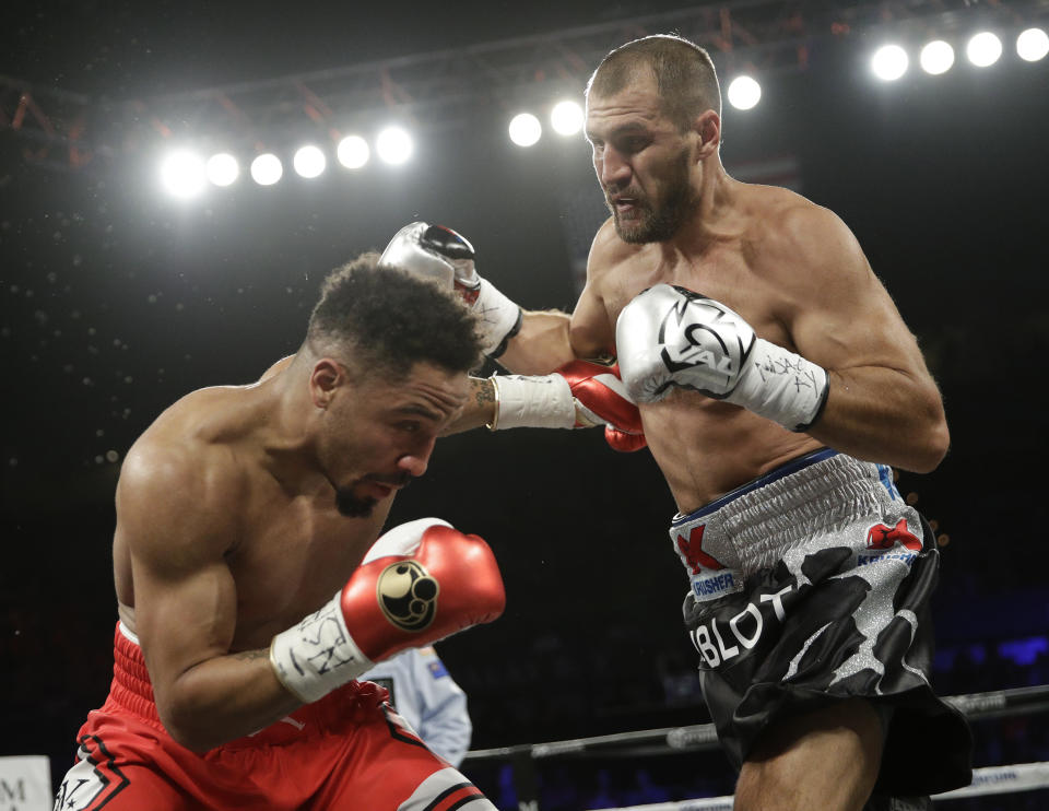 Sergey Kovalev, right, trades punches with Andre Ward during their June rematch. (AP)