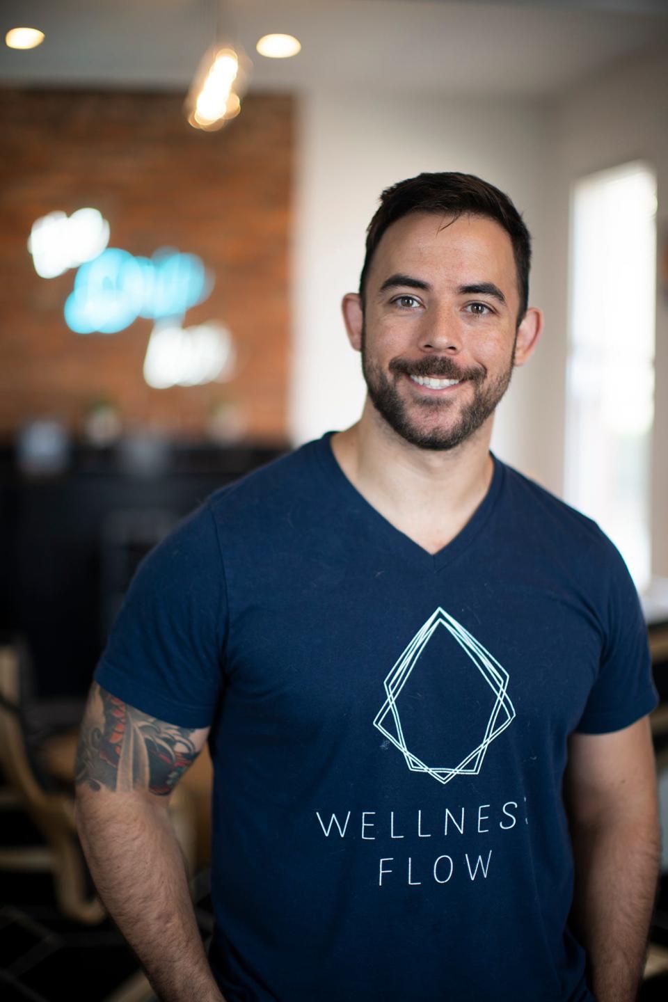 Sean Carroo, shown here in Wellness Flow's Short North studio, founded the company with Paul Adongo.