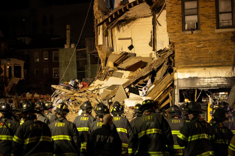 Firefighters assembling at the scene of a collapsed building in the Bronx (AP)