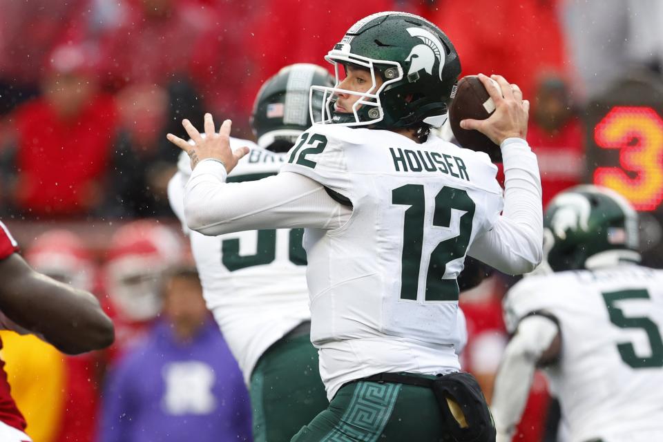 Quarterback Katin Houser of the Michigan State Spartans attempts a pass against the Rutgers Scarlet Knights during the first quarter of a college football game at SHI Stadium on October 14, 2023 in Piscataway, New Jersey.