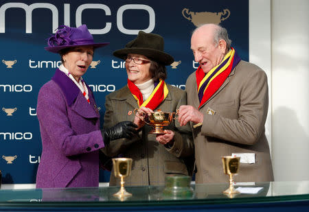 Horse Racing - Cheltenham Festival - Cheltenham Racecourse, Cheltenham, Britain - March 16, 2018 Owners Garth and Anne Broom pose with Princess Anne and the trophy after Richard Johnson rode Native River to victory in the 15.30 Timico Cheltenham Gold Cup Chase Action Images via Reuters/Andrew Boyers