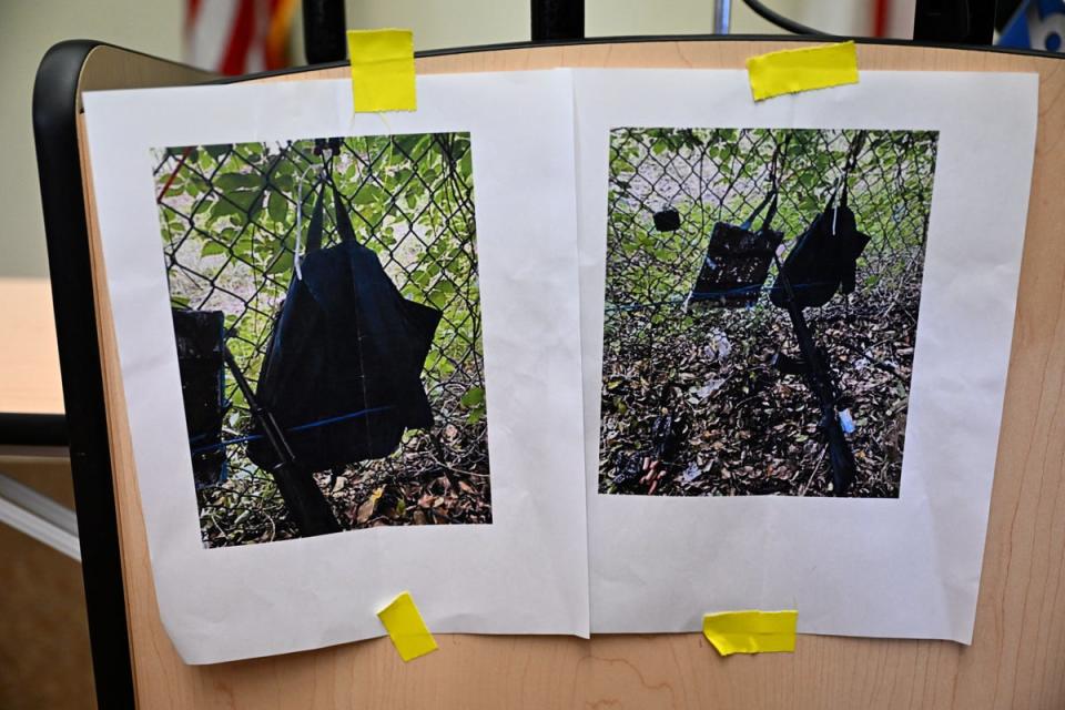 Pictures of evidence found at US President Donald Trump's golf course fence are shown at a press conference in West Palm Beach, Florida (AFP via Getty Images)