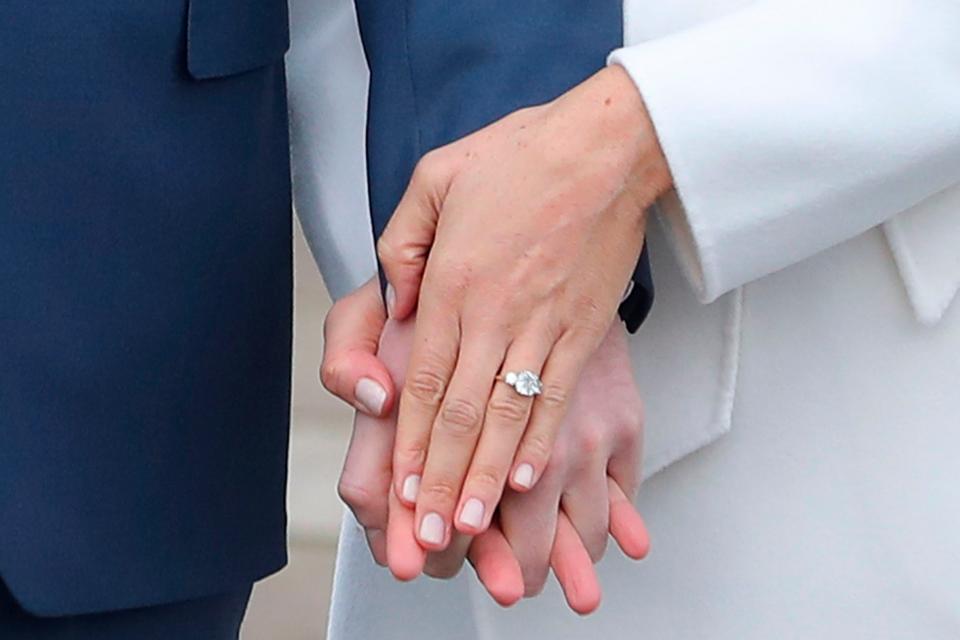 Duchess Meghan shows off her original engagement ring designed by Prince Harry on Nov. 27, 2017.