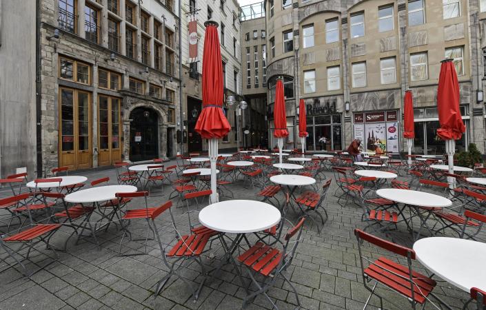 FILE - In this March 18, 2021 file photo, empty tables are seen on a deserted square in normally very busy old town of Cologne, Germany, Thursday. The European Union statistics agency Eurostat announces first-quarter growth figures for the 19 countries that use the euro. (AP Photo/Martin Meissner)