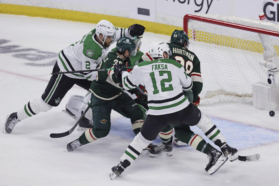 Minnesota Wild right wing Ryan Hartman (38) scores a goal against the Dallas Stars during the first period of Game 3 of an NHL hockey Stanley Cup first-round playoff series Friday, April 21, 2023, in St. Paul, Minn. (AP Photo/Stacy Bengs)