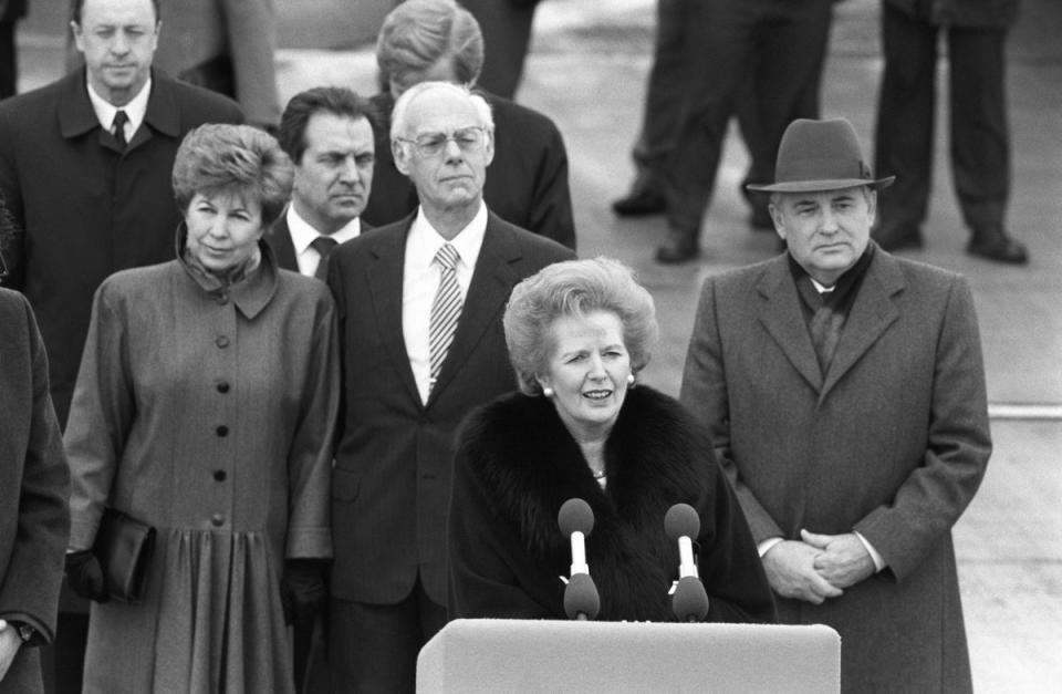 Margaret Thatcher speaks as Soviet president Mikhail Gorbachev (right) and his wife Raisa (left) look on at the end of a state visit to Britain on April 07, 1989 (Getty)