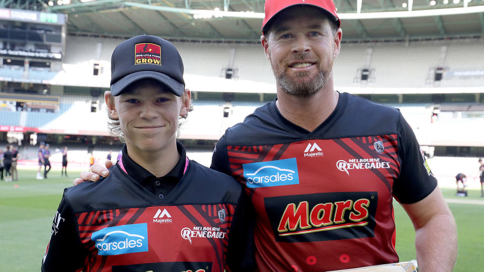 Melbourne Renegades captain Dan Christian poses with the designer of the bat he used in the BBL Indigenous Round.