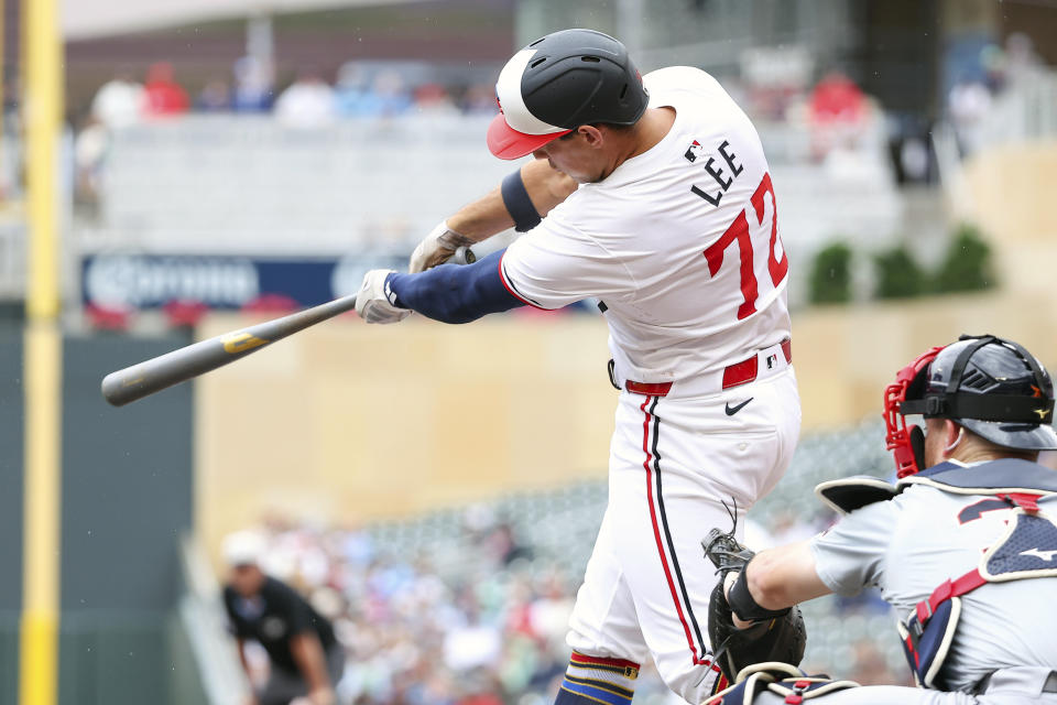 Minnesota Twins' Brooks Lee hits a sacrifice fly against the Detroit Tigers during the second inning of a baseball game, Thursday, July 4, 2024, in Minneapolis. (AP Photo/Matt Krohn)