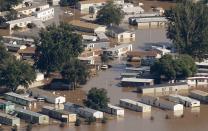 Mobile homes lie flooded in the of town of Evans, Weld County, Colorado in this September 17, 2013 file photo. The mobile home park was left in shambles and partially submerged in water where trailers were swept off their foundations by runoff from a solid week of rains that started September 9. REUTERS/Rick Wilking/Files (UNITED STATES - Tags: DISASTER ENVIRONMENT)