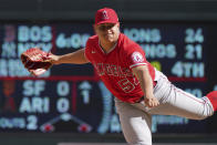 Los Angeles Angels pitcher Jose Suarez follows through on a pitch against the Minnesota Twins in the fourth inning of a baseball game, Sunday, Sept 25, 2022, in Minneapolis. (AP Photo/Jim Mone)