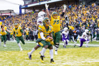 North Dakota State wide receiver Phoenix Sproles (11) smiles after scoring a touchdown during the first half of the FCS championship NCAA college football game against James Madison, Saturday, Jan. 11, 2020, in Frisco, Texas. (AP Photo/Sam Hodde)