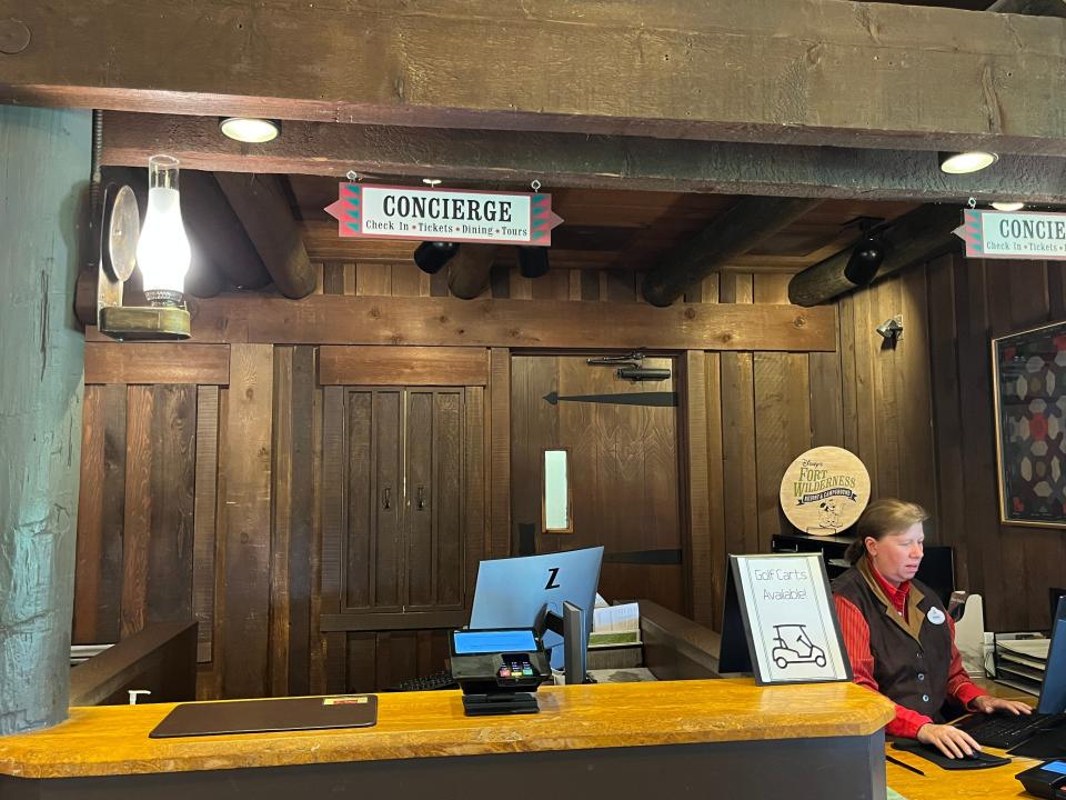 person standing at front desk at disney's fort wilderness camground