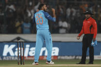 India's Axar Patel, left, celebrates the dismissal of Australia's captain Aaron Finch during the third T20 cricket match between India and Australia, in Hyderabad, India, Sunday, Sept. 25, 2022. (AP Photo/Mahesh Kumar A)