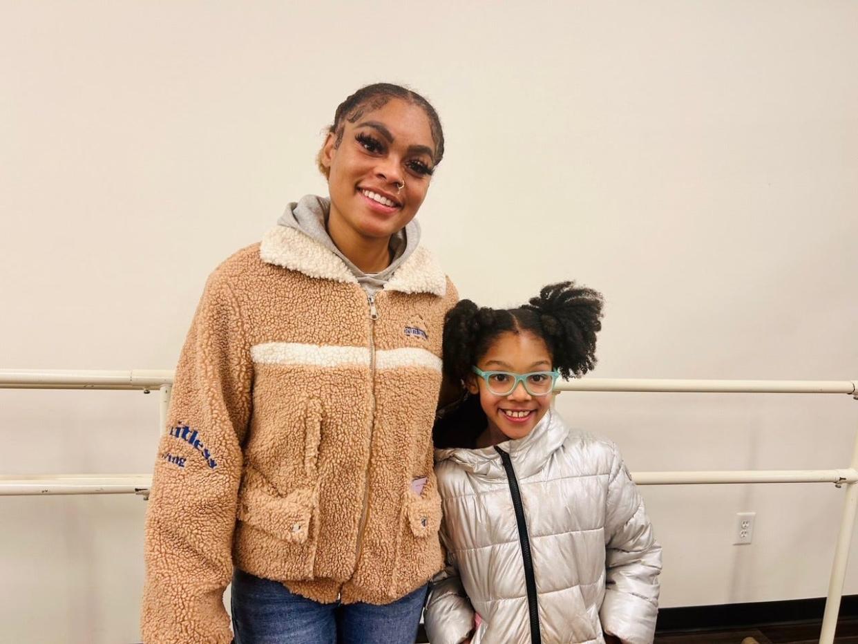 Rachell Johnson poses with her daughter Layla after ballet classes at Above the Clouds, 2431 N. Teutonia Ave. on Dec. 7. Johnson said Layla loves to show her the latest moves she leaned at home and how ballet has built up her confidence.