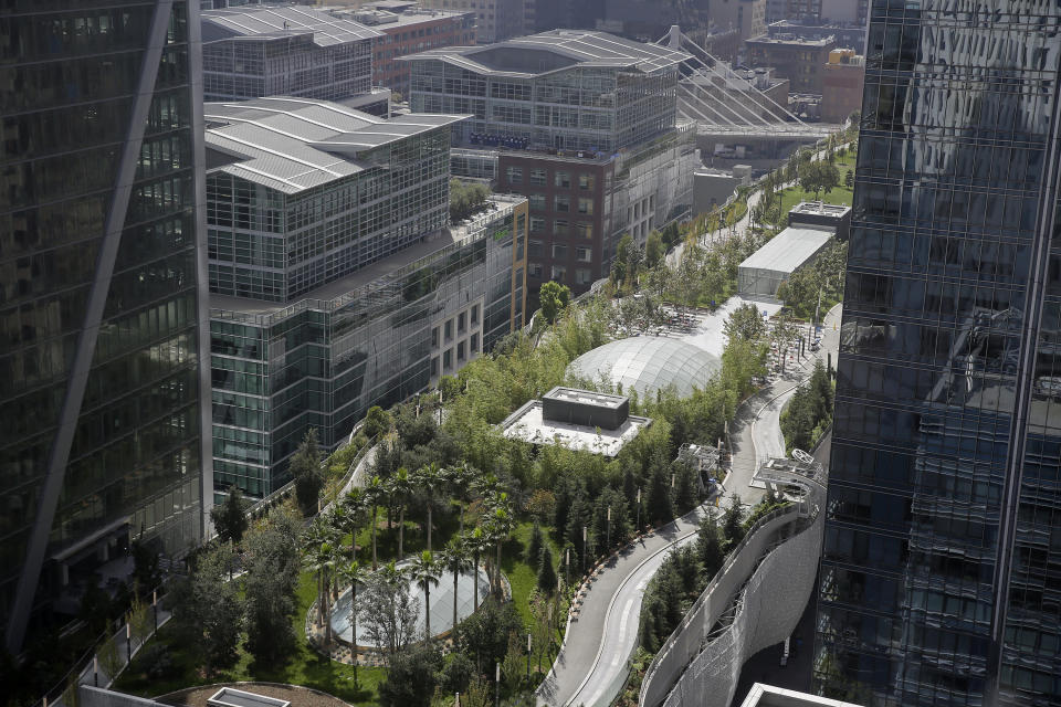 Shown is the roof area of the Salesforce Transit Center above where fissures have been found in the ceiling of the third level bus deck Wednesday, Sept. 26, 2018, in San Francisco. A second beam in San Francisco's celebrated new $2 billion transit terminal shows signs of cracking, an official said Wednesday, a day after a crack in a nearby support beam shut down the building that opened just last month. The first crack found by workers installing roof tiles Tuesday spans a beam holding up a park over the three-block-long facility and runs over a downtown street, Salesforce Transit Center executive director Mark Zabaneh said. (AP Photo/Eric Risberg)