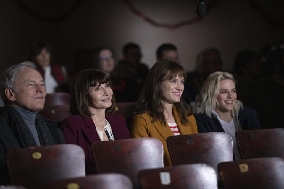 Victor Garber, Mary Steenburgen, Mackenzie Davis and Kristen Stewart sit in a theater in "Happiest Season."