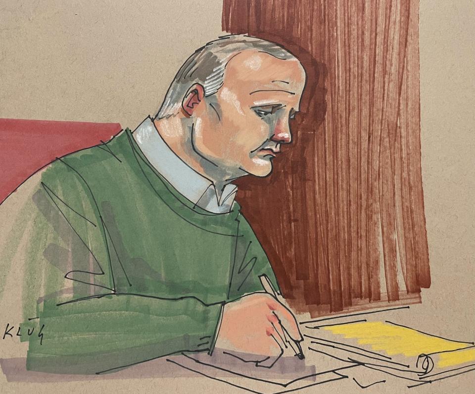 Defendant Robert Bowers takes notes during a sentencing hearing that will determine if he gets a life sentence or the death penalty, in Pittsburgh federal court on Monday, July 31, 2023. Jurors are expected to begin deliberations early Tuesday in the 2018 attack that killed 11 worshippers. (Dave Klug via AP)