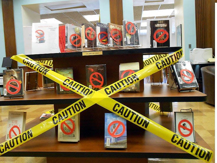 Hawthorne High School Library Media Center welcomed students with a display of popular books and a sign saying, “This week, you cannot read these books!”