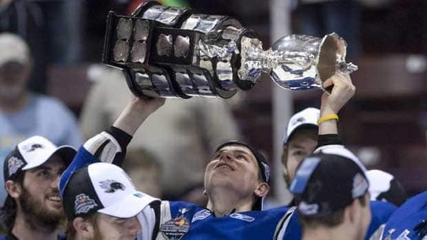 The Saint John Sea Dogs hope the opportunity to host the 2022 Memorial Cup will mean a repeat of this scene, when the team hoisted the cup back in 2011after the Sea Dogs' 3-1 win over hometown Mississauga in the tournament final. (Darren Calabrese/Canadian Press - image credit)