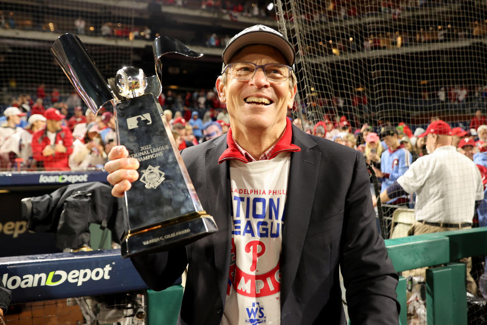 PHILADELPHIA, PENNSYLVANIA - OCTOBER 23: Philadelphia Phillies owner John Middleton lifts the Warren C. Giles trophy after the Phillies defeated the San Diego Padres in game five to win the National League Championship Series at Citizens Bank Park on October 23, 2022 in Philadelphia, Pennsylvania. (Photo by Tim Nwachukwu/Getty Images)