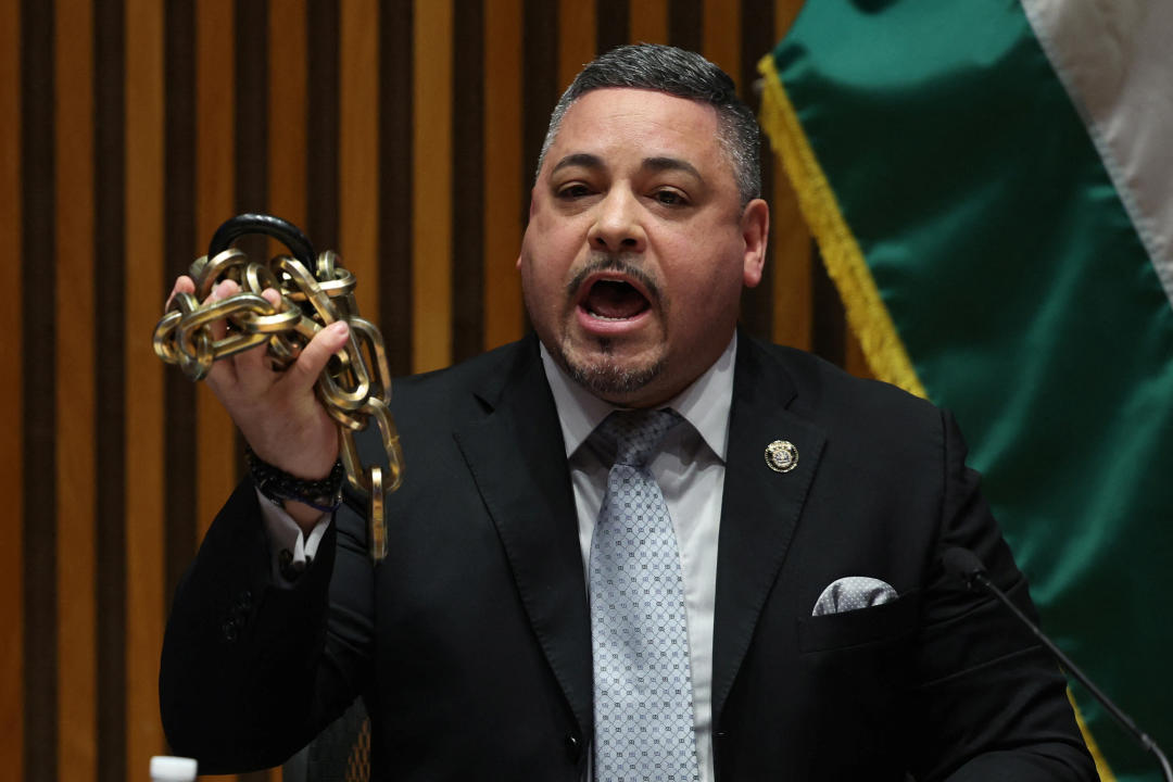 NYPD Commissioner Edward Caban speaks at a press conference Wednesday while holding up chains and a lock removed by officers during their overnight operation to clear protesters from Columbia University. 