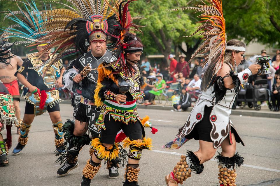 The Yotl Tonaztin dance group performs an Aztec dance at the beginning of El Concilio's annual Cinco de Mayo parade and festival in downtown Stockton on Sunday, May, 7, 2023.