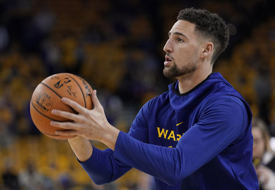 Golden State Warriors guard Klay Thompson warms up before Game 4 of basketball's NBA Finals against the Toronto Raptors in Oakland, Calif., Friday, June 7, 2019. (AP Photo/Tony Avelar)